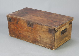 A 19th Century pine chest with hinged lid and iron drop handles 29cm h x 75cm w x 40cm d (split to top)