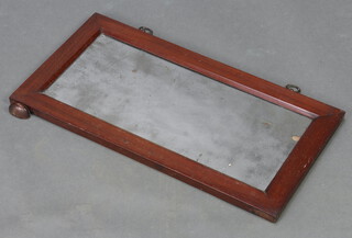 A 19th Century rectangular plate over mantel mirror contained in a mahogany frame 30cm x 56cm (missing foot) 