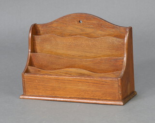 An Edwardian Art Nouveau light oak arched 4 division letter rack 22cm h x 30cm w x 12cm d 
