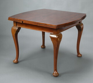 A 1950's walnut Queen Anne style draw leaf dining table on cabriole supports 75cm h x 96cm  x 94cm (some scratches in places) 