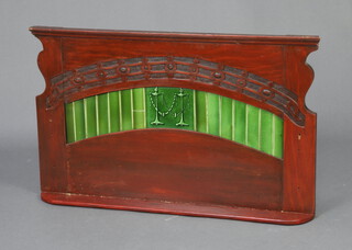 An Art Nouveau mahogany and tiled shelf  85cm w x 8cm d  