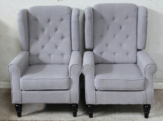 A pair of winged armchairs upholstered in grey buttoned material 104cm h x 66cm w x 64cm d (seat 39cm x 41cm) 