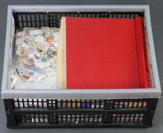 A collection of loose world stamps, a Stanley Gibbons Malta and Gibraltar album and a Stanley Gibbons Windsor Great Britain volume 2 album, contained  in a grey plastic case 