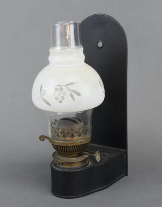 A wall mounted brass oil lamp with frosted glass shade 29cm  