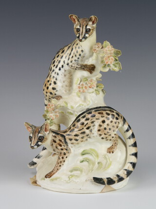A porcelain group of 2 ocelots amongst flowers, signed Phyllida 22cm  (tail  chipped,are minor chips to flowers) 