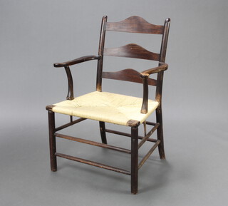 A 17th Century style elm ladder back carver chair with woven cane seat 92cm h x 64cm d x 46cm w (seat 43cm x 36cm) 
