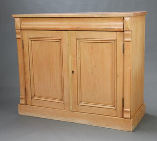 A Victorian pine chiffonier fitted a secret drawer above cupboard with shelved interior enclosed by panelled doors, raised on a platform base 104cm h x 123cm w x 51cm d (Some contact marks in places, split and ring mark to the top) 