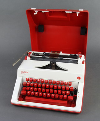 An Olympia Monica portable manual typewriter contained in a carrying case