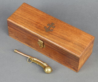 A reproduction copper and brass bosun's call contained in a rectangular box with brass inlay, the lid decorated an anchor  7cm x 21cm x 7cm