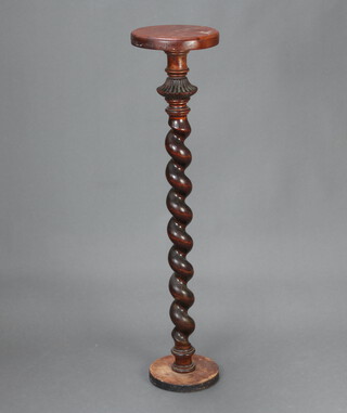An oak and turned beech torchere raised on a spiral turned column 104cm h 