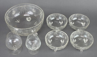 A cut glass fruit bowl, 4 dessert bowls and 2 brandy glasses 