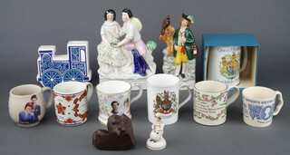 A Carlton Ware money box in the form of a locomotive, 2 reproduction Staffordshire figures and a small collection of Coronation mugs
