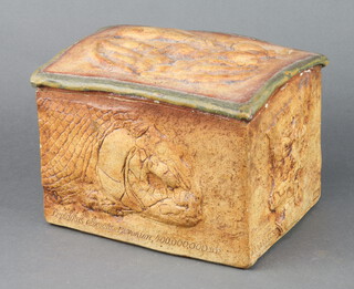 A stoneware bread bin and cover with moulded decoration 
