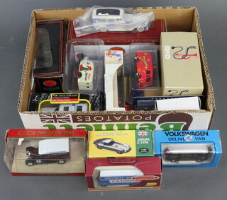 A boxed Atlas Jaguar E-type model car, a quanity of other boxed toys