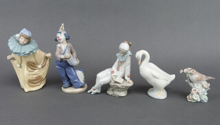 A Nao figure of a boy clown 20cm, a ditto 20cm, seated Pierro 17cm and 2 birds (1 chipped)
