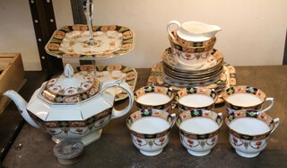 A Derby style Royal Vale china tea set comprising tea pot, 6 teacups and saucers, cream jug, sugar bowl, 6 side plates, sandwich plate and cake stand