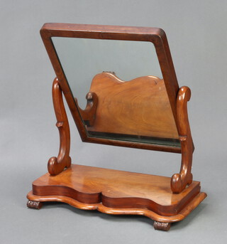 A Victorian rectangular plate dressing table mirror contained in a mahogany swing frame, the base of serpentine outline 69cm h x 72cm w x 27cm d (silvering to the mirror is showing signs of deterioration) 