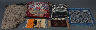 A quantity of various fabrics and cushions