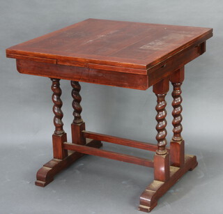 A 1930's oak draw leaf dining table raised on spiral turned supports with H frame stretcher 76cm h x 76cm w x 76cm d