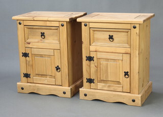 A pair of bleached hardwood bedside cabinets fitted a drawer above cupboard 67cm h x 53cm w x 39cm d 