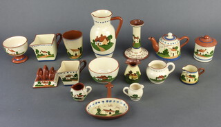 A motto ware jug 19cm, a ditto chamber stick and a quantity of motto ware vessels