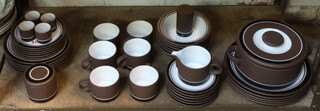 A Hornsea contrast pattern dinner service comprising 5 dinner plates, 6 dessert plates, 6 side plates, 6 teacups, 6 saucers, 6 cereal bowls, 4 egg cups, a deep bowl, a casserole dish and cover, a milk jug, sugar bowl and lid and pepperpot