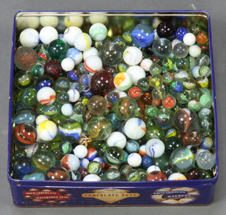 A tin of assorted marbles