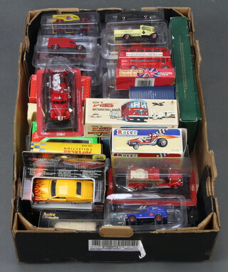 A fruitbox containing a collection of various boxed model cars