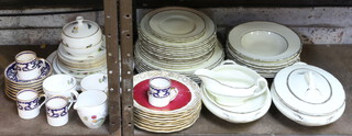 A Royal Doulton part dinner service with silver band decoration comprising 3 small plates, 11 medium plates, 7 dinner plates, 8 soup bowls, a tureen and cover, a tureen, a sauceboat, minor table china