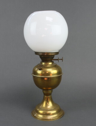 A brass oil lamp with white glass shade 34cm 