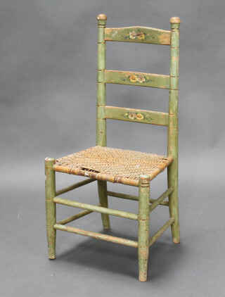 A child's green painted pine ladder back chair with woven rush seat 76cm h x 38cm w x 28cm d (some wear to the rush) 
