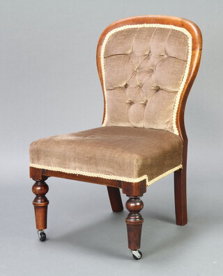 A Victorian mahogany show frame nursing chair upholstered in mushroom coloured material, raised on turned supports (cut down) 74cm h x 47cm w x 47cm d  (seat 32cm x 28cm) 