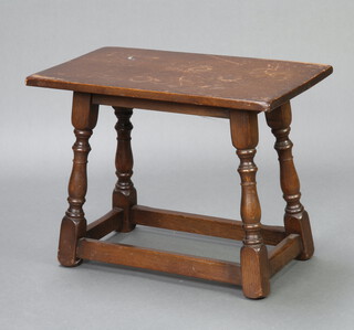A rectangular oak stool/table raised on turned and block supports 42cm h x 58cm w x 33cm d 
