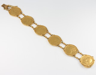 A yellow metal bracelet (stamped 18k and 750), containing 6 sovereigns - 1884, 1889, 1899, 1903, 1916 and 1917, the yellow metal mount approx. 22 grams, gross weight 70.5 grams  