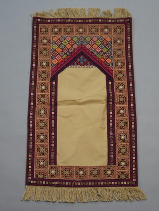 An Israeli purple, pink and green ground prayer rug 87cm x 50cm, the reverse marked Palestinian Embroidery 