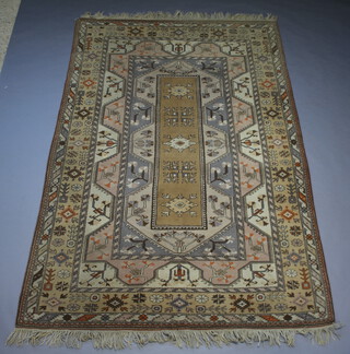 A Caucasian style brown and blue ground rug with central medallion within a multi-row border 297cm x 199cm 