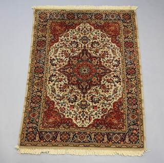 A white and red ground machine made Persian style carpet with central medallion 196cm x 140cm 