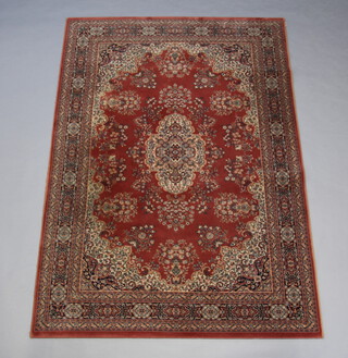 A pink and white ground Persian style machine made rug 242cm x 171cm 