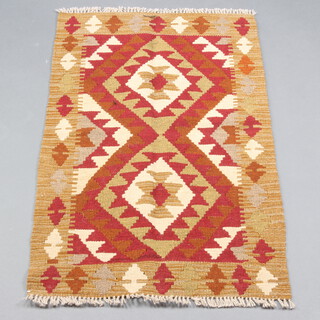 A tan and white ground Maimana Kilim 103cm x 63cm with all over geometric designs 