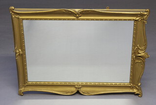 A 20th Century Victorian style rectangular plate wall mirror contained in a decorative gilt frame 84cm h x 99cm w x 6cm d