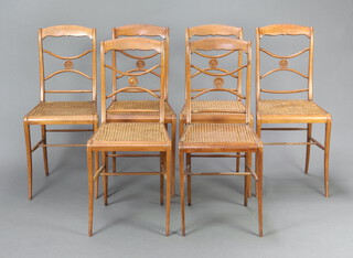 A set of 6 19th Century beech framed chairs with shaped mid rails and woven cane seats, raised on sabre supports (Formerly part of the Anouska Dimple Christies sale) 84cm h x 38cm w x 34cm d (seat 28cm x 23cm) 
