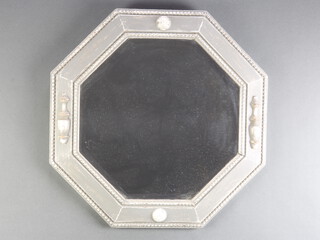 A 1920's octagonal bevelled plate wall mirror contained in an oak silver painted frame 55cm x 54cm 