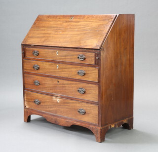 A Georgian mahogany bureau with crossbanded and fall front revealing a fitted interior above 3 graduated drawers with ivory escutcheons and original handles, raised on bracket feet 107cm h x 101cm w x 51cm d 