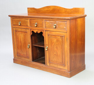 An Edwardian Art Nouveau walnut sideboard with raised back and 3 drawers above recess, flanked by a pair of cupboards with brass pear drop handles 100cm h x 127cm w x 46cm d 
