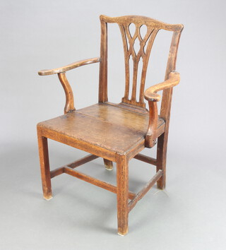 A Georgian Chippendale style country oak carver chair with solid seat raised on square supports with H framed stretcher 91cm h x 72cm w x 46cm d (seat 39cm x 38cm) 