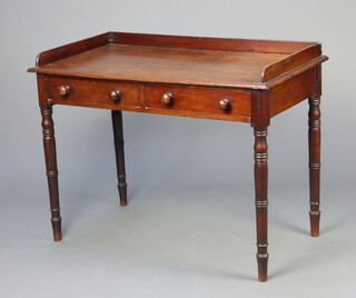 An Edwardian mahogany wash stand with 3/4 gallery fitted 2 drawers, raised on turned supports 76cm h x 101cm w x 52cm d 