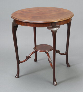 An Edwardian circular mahogany 2 tier occasional table raised on cabriole supports with plate glass top 70cm h x 66cm diam. 