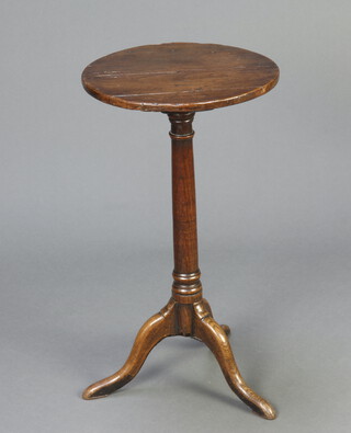 An 18th/19th Century circular oak wine table, raised on a turned column with tripod base 66cm h x 36cm diam. 