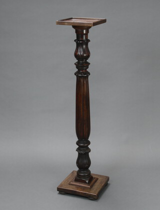 A Victorian turned mahogany bedpost torchere with square top 124cm h x 25cm w x 25cm d 
