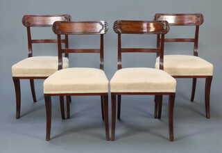 A set of 4 Georgian mahogany bar back dining chairs with plain mid rails and overstuffed seats, raised on sabre supports 84cm h x 47cm w x 42cm d (seat 28cm x 30cm) 